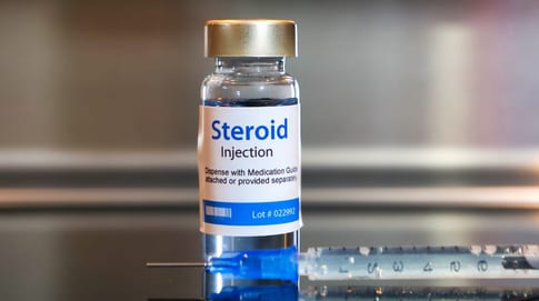 Clinician administering a corticosteroid injection